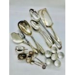 A selection of silver plate to include six serving spoons, two cake slices, fish servers, salad