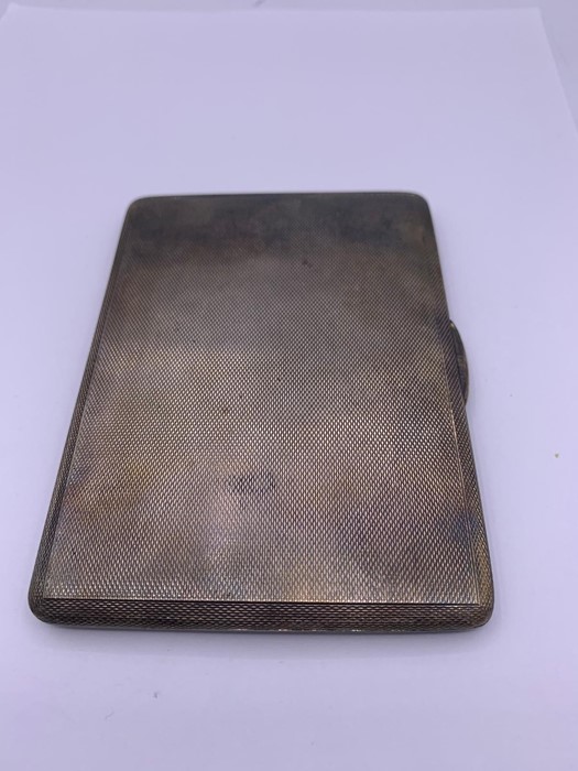 A silver cigarette case, hallmarked London 1946 by PB & S