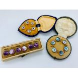 Three sets of vintage, cased buttons.