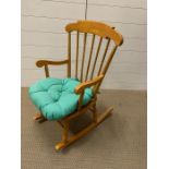 A child's pine rocking chair