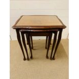 Set of three glass top nest of tables