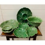 A selection of cabbage Majolica plates serving dishes and bowls, various makers.