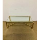 A brass and glass contemporary coffee table (128cm x 68cm)