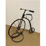 An antique Victorian Penny Farthing child's bike with stand AF