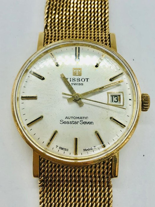 A Gents Tissot watch on a 9ct gold strap, watch not working