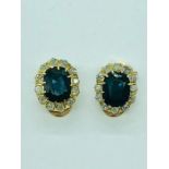 A pair of yellow gold sapphire and diamond clip on earrings of approx. 4.5cts