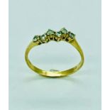 An unusual 18ct yellow gold six stone diamond ring.