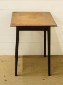 A square topped occasional table with tapered legs