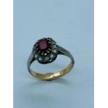 A Ruby 9ct gold and silver ring.
