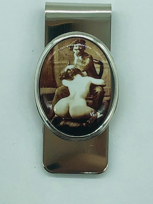 A Silver Clip with nude pictorial image