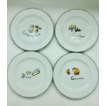 A set of Four Pottery Barn cheese plates