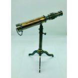 A cased brass telescope on stand