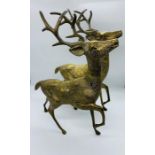 A pair of brass stags