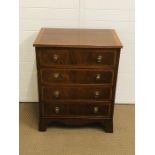 A small mahogany chest of drawers to include four drawers with brass pull ring handles