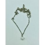 An 18ct white gold diamond pendant necklace of approx. 70 points