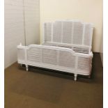A large modern white painted wooden ornate bed to fit a 6ft mattress