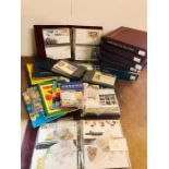 A Large collection of First Day Covers in multiple albums and loose stamps.