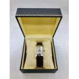 A Dunhill Facet Gents dress watch on leather strap. with original box and paperwork.