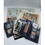 A large selection of pre decimal International stamps and a few post cards