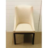 A cream upholstered contemporary chair made by Decca and labelled accordingly
