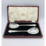 A boxed set of silver plated serving spoons from James Walker Ltd.
