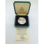 A Limited Edition Medallion by Garrard in Sterling Silver celebrating the Centenary of the Wimbledon