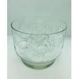 An engraved glass punch bowl with ladle and nineteen cups in total, ten in one style and nine in