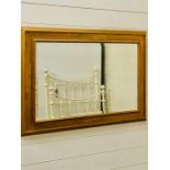 A gold painted wooden framed bevelled mirror (100cm x 69cm)