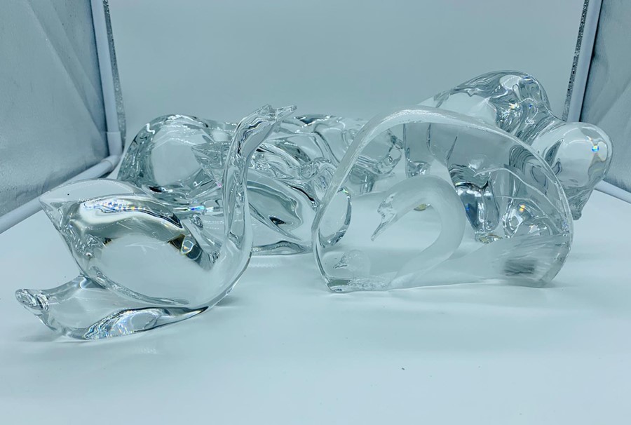 A collection of five Baccarat crystal animals to include a signed swan paperweight