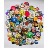 A large selection of vintage pin badges