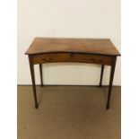 An elegant hall table with indented curved top on four tapered legs with one drawer