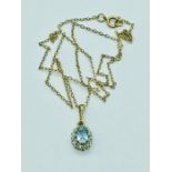 An Aquamarine pendant on a 9ct gold chain