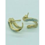 A pair of 18ct gold and diamond earrings (3.3g)