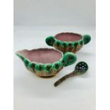 A pair of rare Wedgwood Majolica peacock design sauce boats, one with ladle.