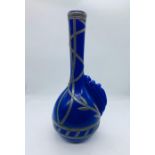 A blue art glass vase with pewter mount