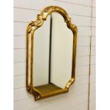 A modern gilt and ivory framed mirror