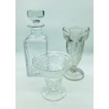 A selection of cut crystal glass to include two celery vases and a decanter