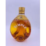 An Old Bottle of Dimple Blended Whisky presented in the brand's trademark bottle and closed with a