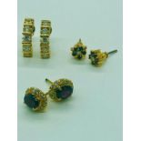 A selection of three sets of gold earrings