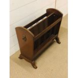 A mahogany magazine rack