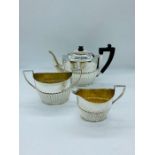 A Three piece Victorian tea set to include teapot, milk jug and sugar bowl, Sheffield 1893.