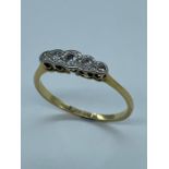 A five stone diamond ring on 18ct gold and platinum.