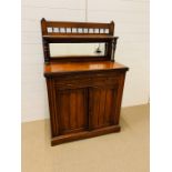 A regency satinwood chiffonier with mirrored back (H139cm W90cm D44cm)