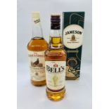 A selection of three whiskies to include Jameson, Bells and Famous Grouse