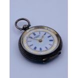 An ornate Ladies pocket watch marked .935 to inside of case.
