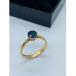 A Sapphire ring in a 9ct yellow gold setting.