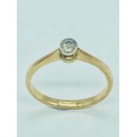 A 15ct yellow gold ring with a diamond. (1.9g)