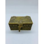 A Brass stamp box with George and the Dragon decoration.