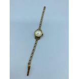 9ct Mira Ladies gold watch on a 9ct gold strap (13.96g)
