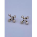 A pair of pearl earrings